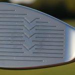 Close-up view of sharp wedge grooves designed for maximum golf ball spin and control